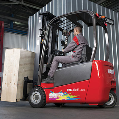 Picture showing a Manitou Lift truck carrying a load in a warehouse